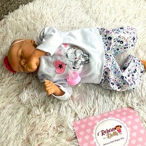 Reborn life-like infant doll Happy Day cloth body